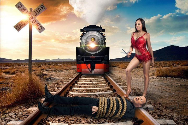 a woman riding a bike down a dirt road